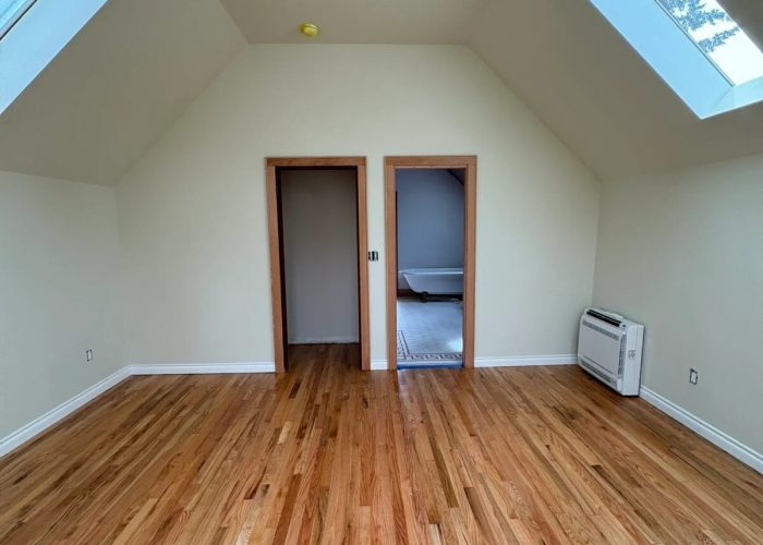 Primary bedroom, updated entry and bathroom entry.