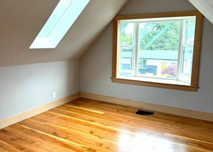 Updated upper-half room, new entry, new reclaimed flooring, trim and paint.