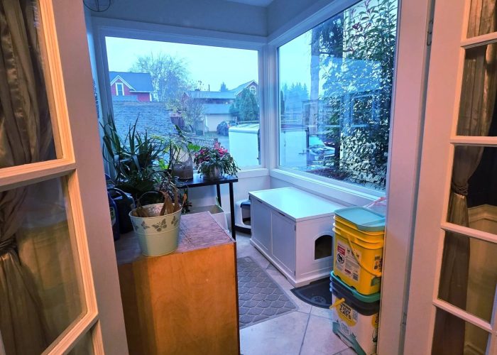 Updated sunroom with reinforced framing and new windows.
