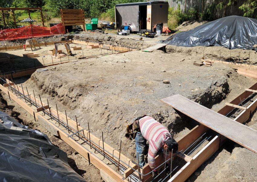 A construction working working on the foundation.