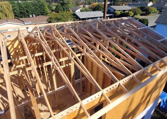Second story addition new roof truss framing.