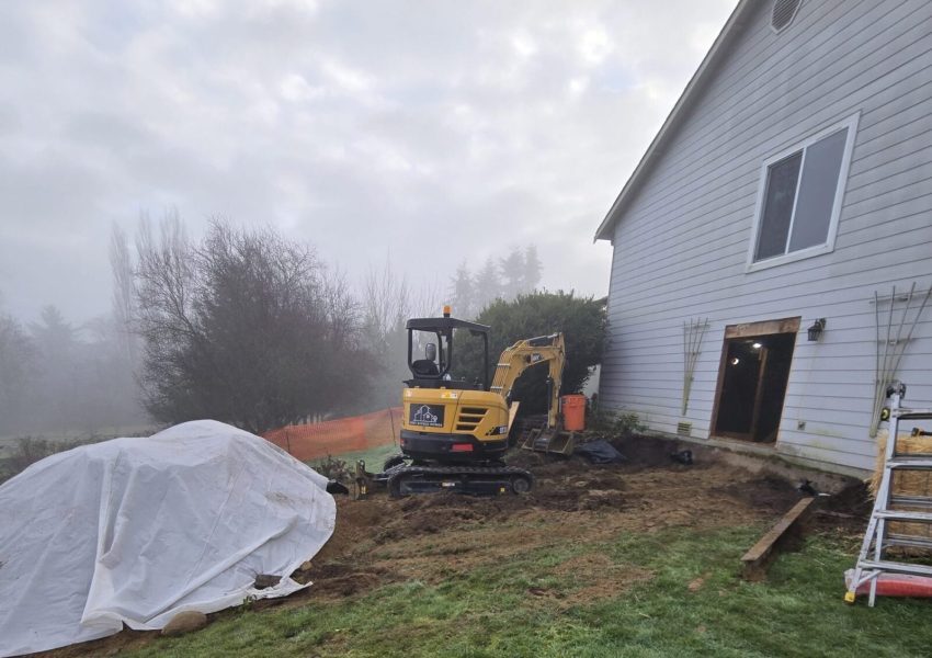 An excavator preparing the ground for work.