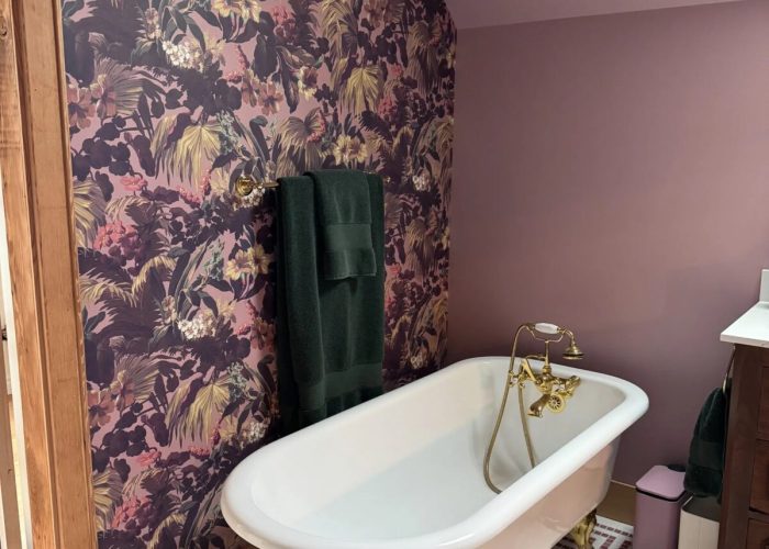 Primary bathroom with reclaimed vintage clawfoot tub.