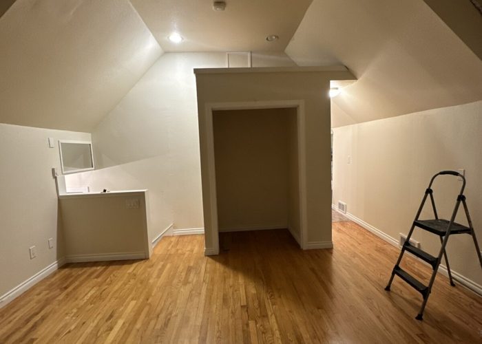 A view from another angle of the primary bedroom before the addition.