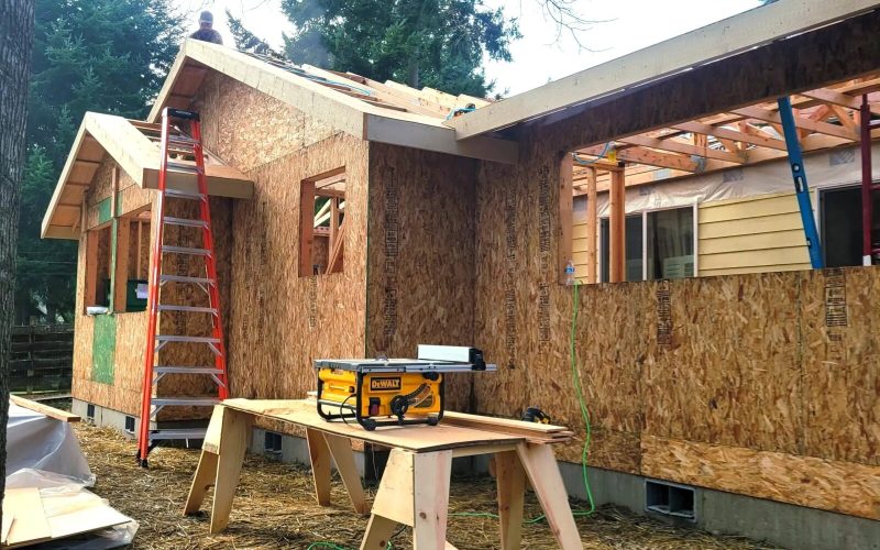 Side view of home addition with framing complete.