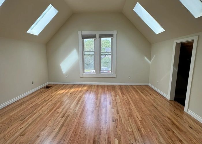 Primary bedroom new reclaimed flooring, updated his closet access.