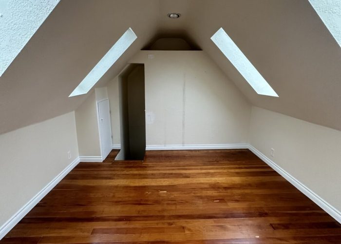 Before photo of upper half-floor room.