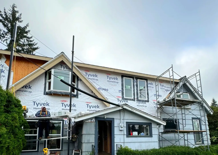 Front view of second addition with new windows and matching hand-sawn cedar shingle siding.